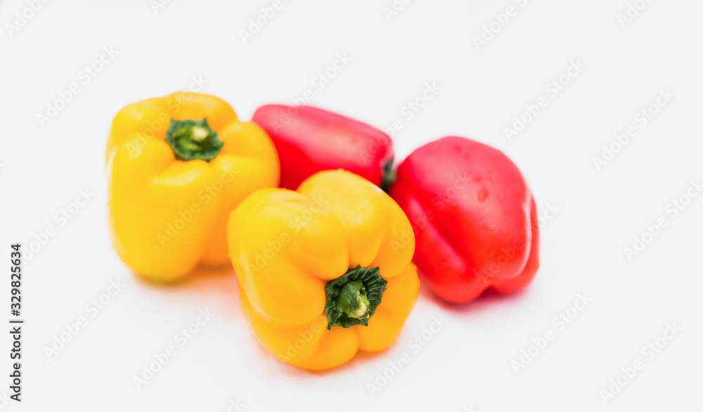 yellow and red peppers food on white background yellow and red peppers food on white background
