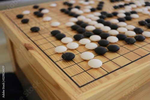 Checkers on a wooden board. Checkers are an activity that is a practice of thinking skills and good concentration.