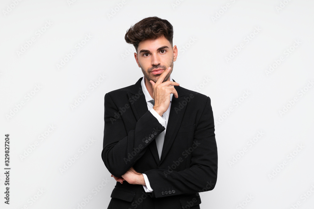 Young businessman over isolated white background thinking an idea Young businessman over isolated white background thinking an idea