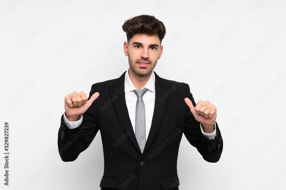Young businessman over isolated white background proud and self-satisfied Young businessman over isolated white background proud and self-satisfied
