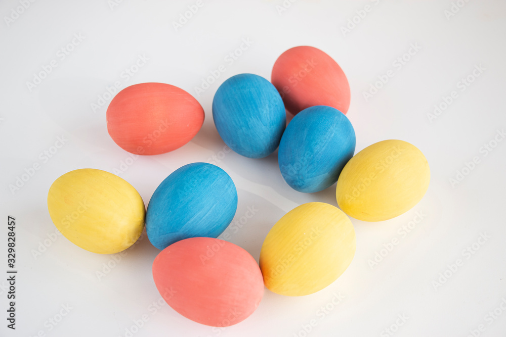Easter card. A large number of multi-colored eggs on a white background. Copy space for text. Easter card. A large number of multi-colored eggs on a white background. Copy space for text.