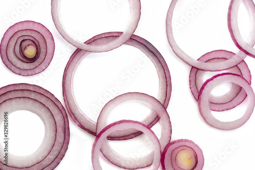 Fresh red onion rings on white background