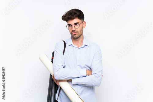 Young architect man over isolated white background thinking an idea