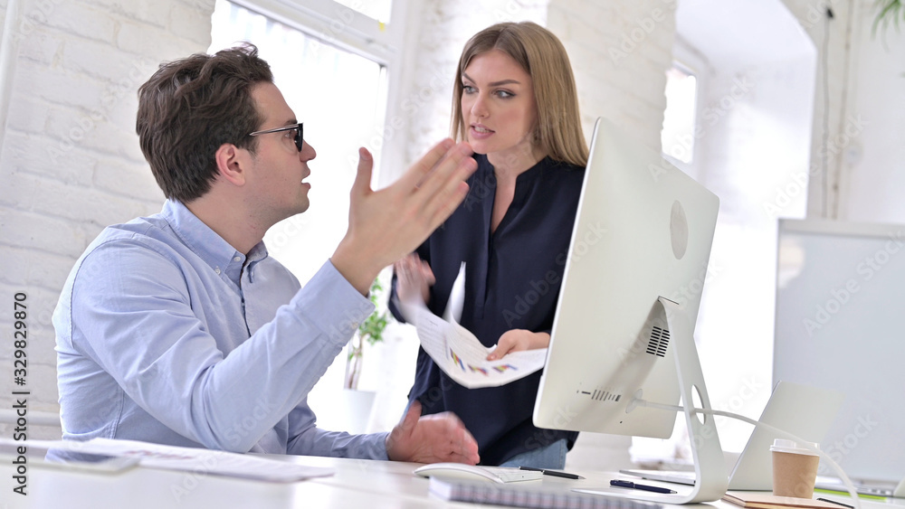 Angry Creative Team Arguing about Documents in Office