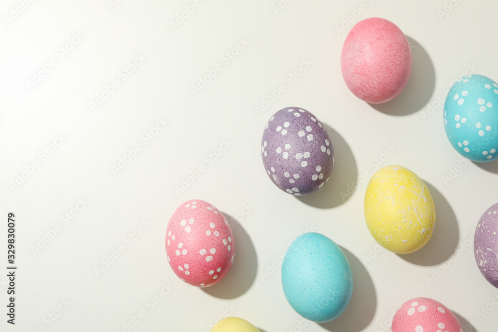 Multicolor Easter eggs on white background, space for text