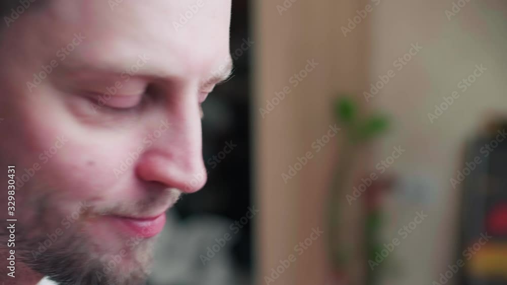 A close up of a bearded man appearing in front of camera A close up of a bearded man appearing in front of camera