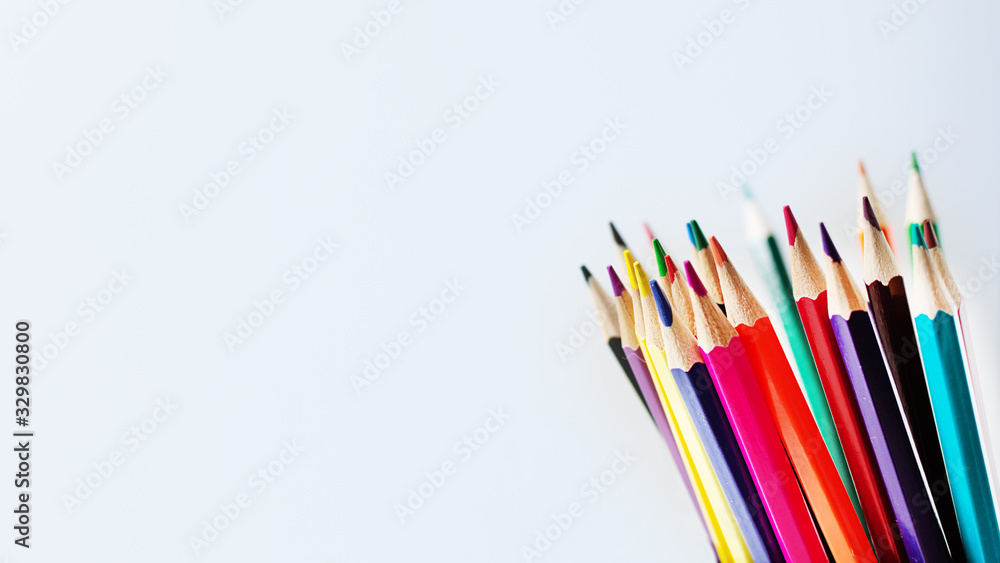 Fototapeta premium Colorful pencils on white wooden background. Education concept.