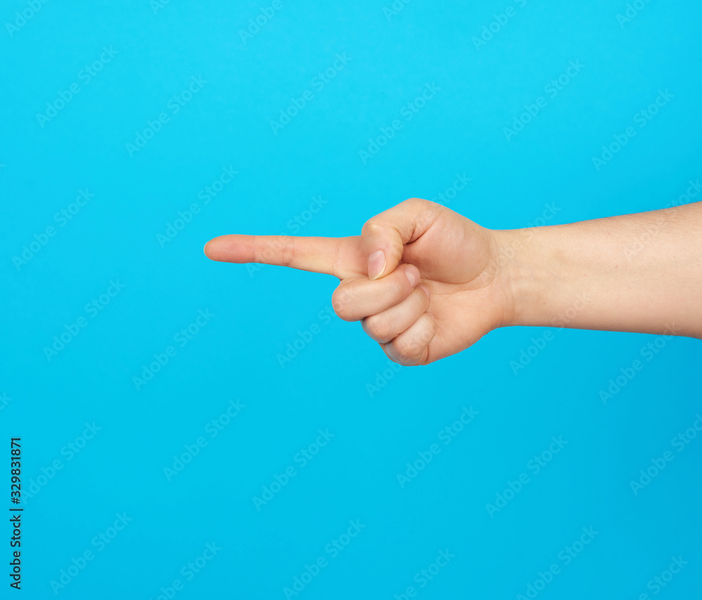 hand shows forefinger gesture on a blue background hand shows forefinger gesture on a blue background
