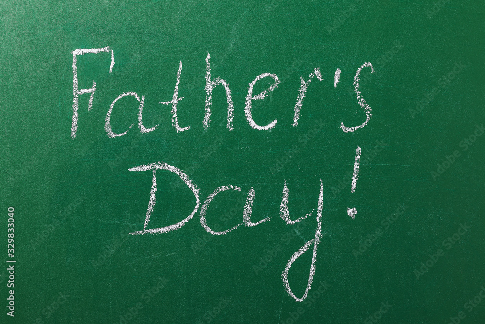 On the school board is written the name of the holiday for dad On the school board is written the name of the holiday for dad