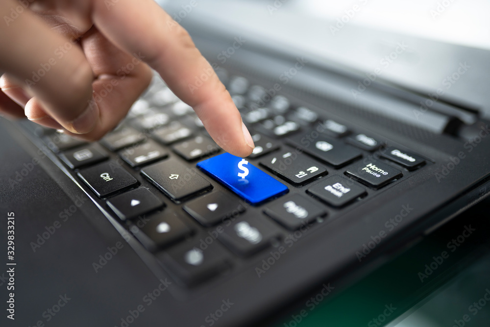 laptop keyboard with finger pressing Shopping key, Online shopping concept laptop keyboard with finger pressing Shopping key, Online shopping concept