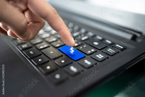 laptop keyboard with finger pressing Shopping key, Online shopping concept