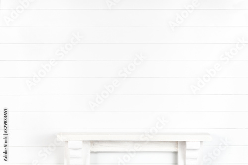 Mock-up of a white wall with a mantelpiece for your design