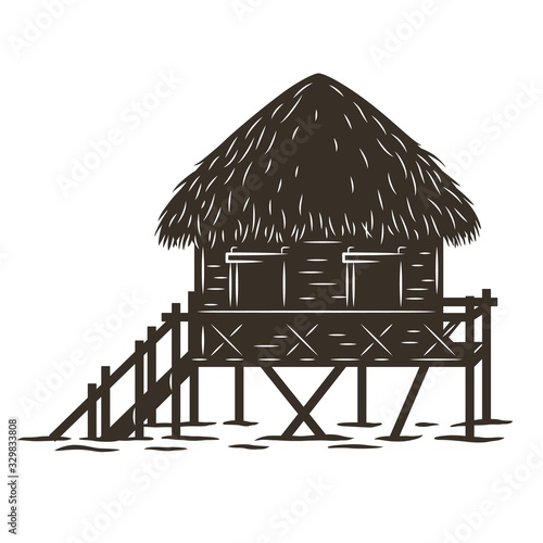 Silhouette of a bungalow standing on the water