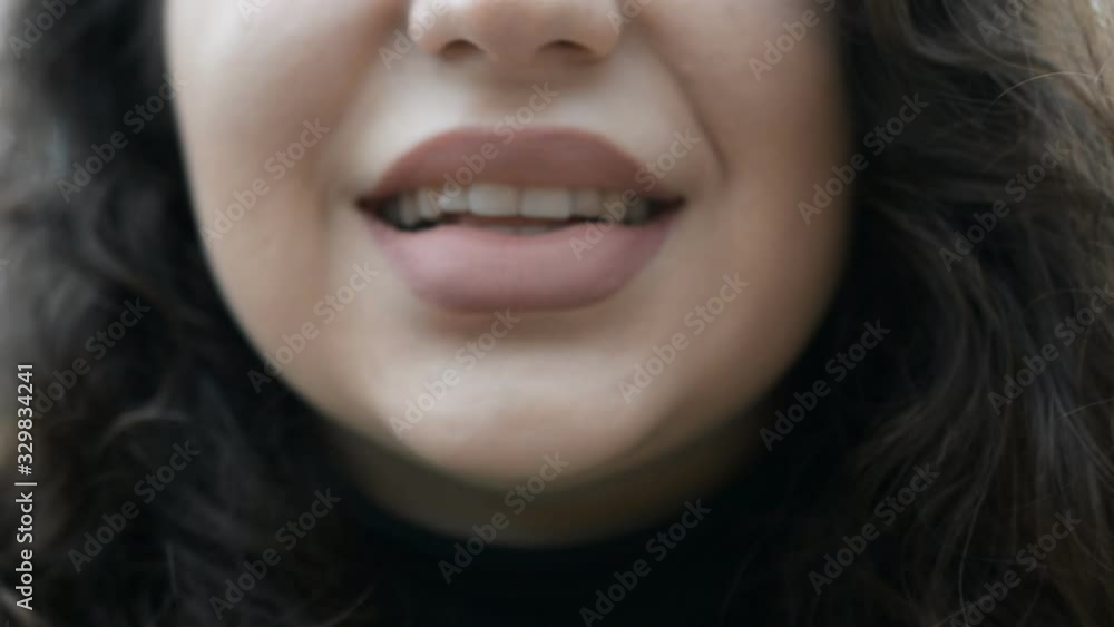 Extreme close-up female mouth with big lips Extreme close-up female mouth with big lips
