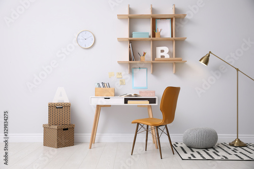 Stylish room interior with modern comfortable workplace photo