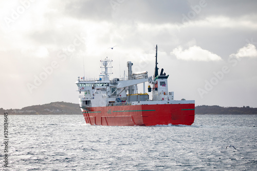Cargo ship arrives Br  nn  ysundet in northern Norway 