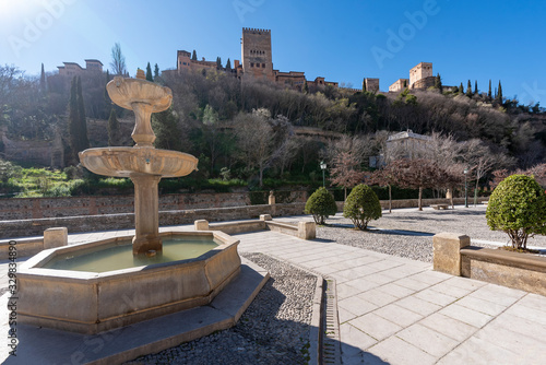 Paseo de los Tristes parallel to the river Darro and at the foot of the Alhambra Palace photo