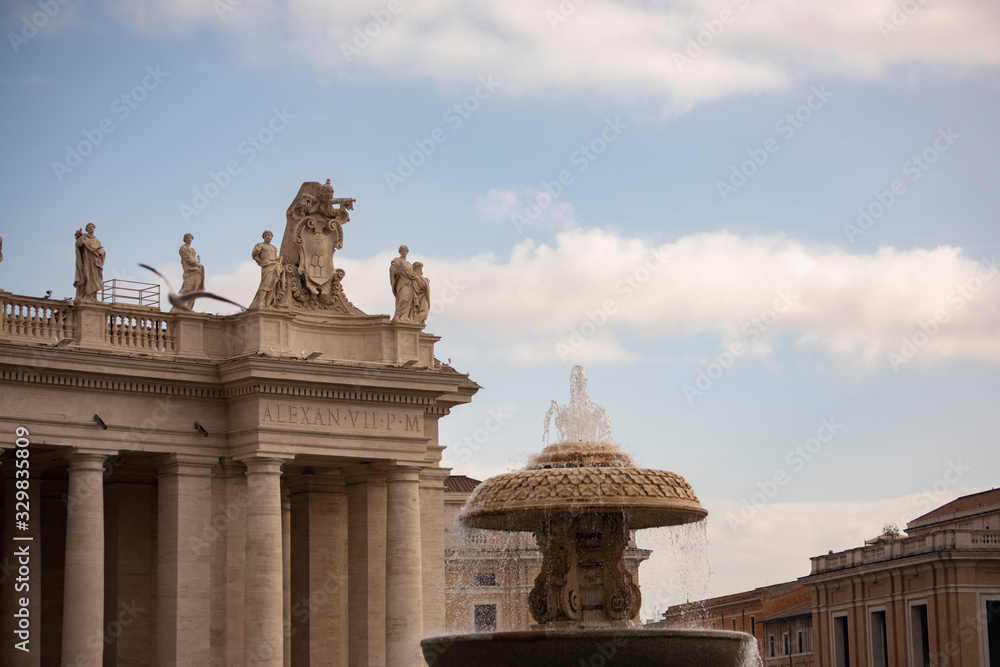 Detail of the facade of St. Peter's Basilica and Bernini's fountain, Rome, Italy. One of the largest buildings in the world since 1600