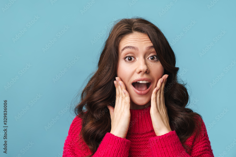 Photo of caucasian happy woman raising hands and expressing surprise Photo of caucasian happy woman raising hands and expressing surprise