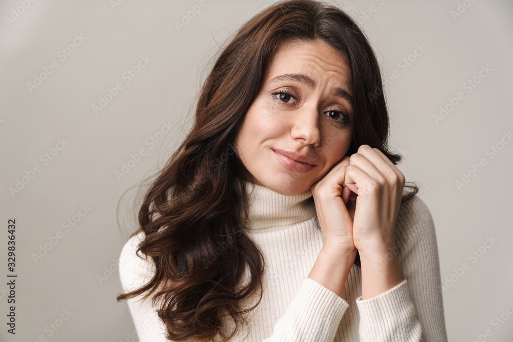 Photo of caucasian happy woman with long brown hair smiling at camera Photo of caucasian happy woman with long brown hair smiling at camera