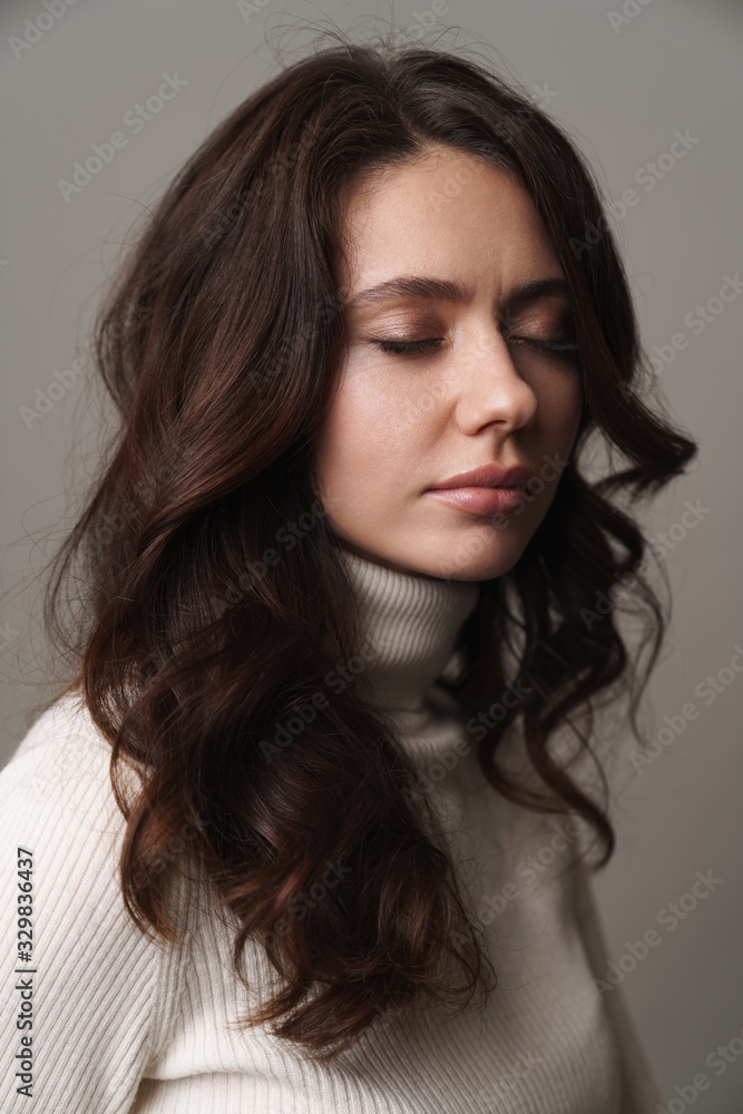Photo of caucasian young woman standing with eyes closed Photo of caucasian young woman standing with eyes closed