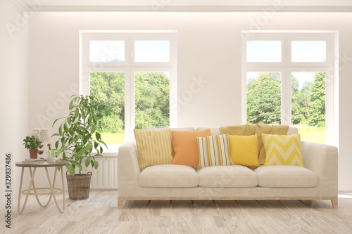 Wallpaper Mural Minimalist living room in white color with sofa and summer landscape in window. Scandinavian interior design. 3D illustration Torontodigital.ca