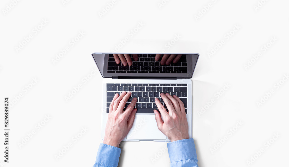 Fototapeta premium Businessman using a laptop computer overhead view