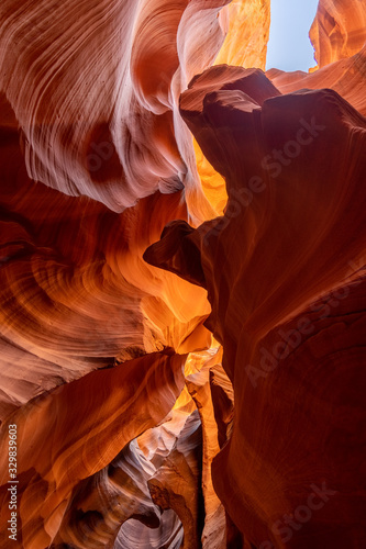 Looking upwards to the blue sky in antelope canyon