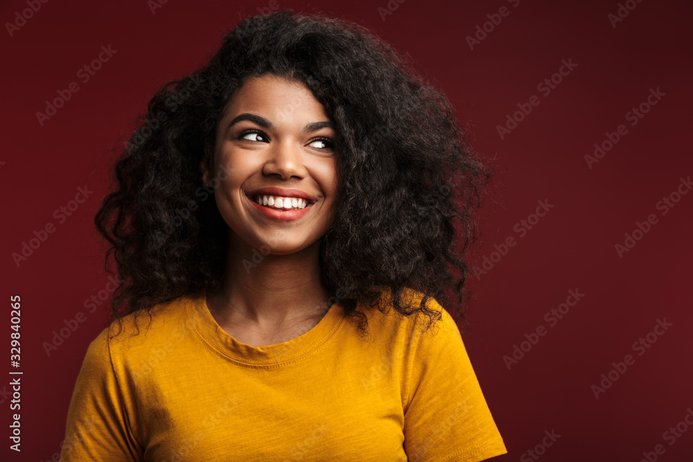 Image of beautiful brunette african american woman with curly hair smiling Image of beautiful brunette african american woman with curly hair smiling
