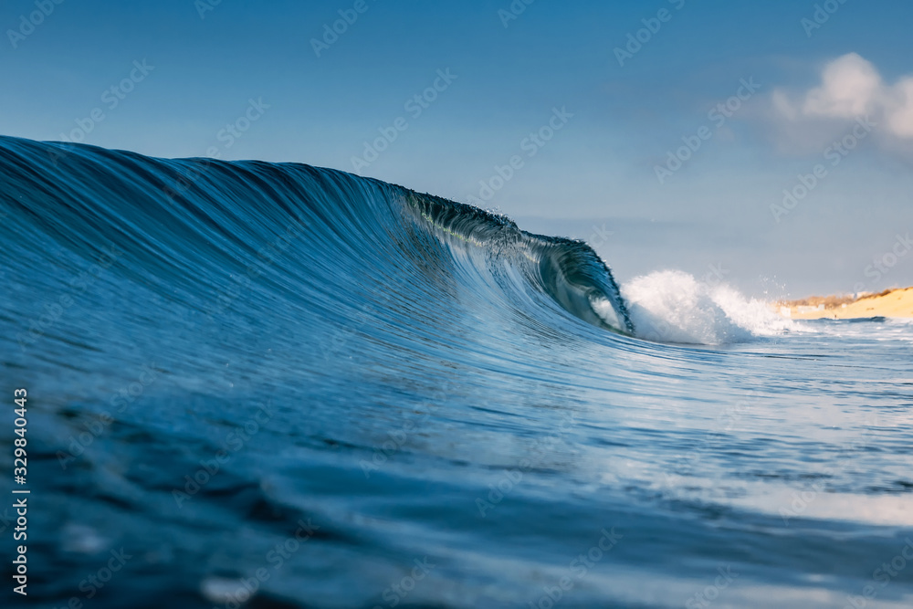 Ocean ideal wave in ocean. Breaking blue wave Ocean ideal wave in ocean. Breaking blue wave
