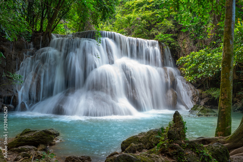 Fototapeta Naklejka Na Ścianę i Meble -  A beautiful waterfall deep in the tropical forest, steep mountain adventure in the rainforest.