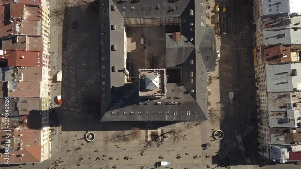 Aerial view to Central City Hall in the tourist center of Lviv city with tourist on it, Ukraine Aerial view to Central City Hall in the tourist center of Lviv city with tourist on it, Ukraine