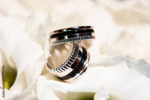 Elegant white gold engagement rings on petals