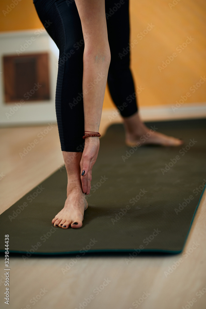 Closeup of middle aged brunette in Tripod Headstand yoga pose. Closeup of middle aged brunette in Tripod Headstand yoga pose.