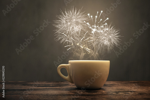 A cup with fireworks over it