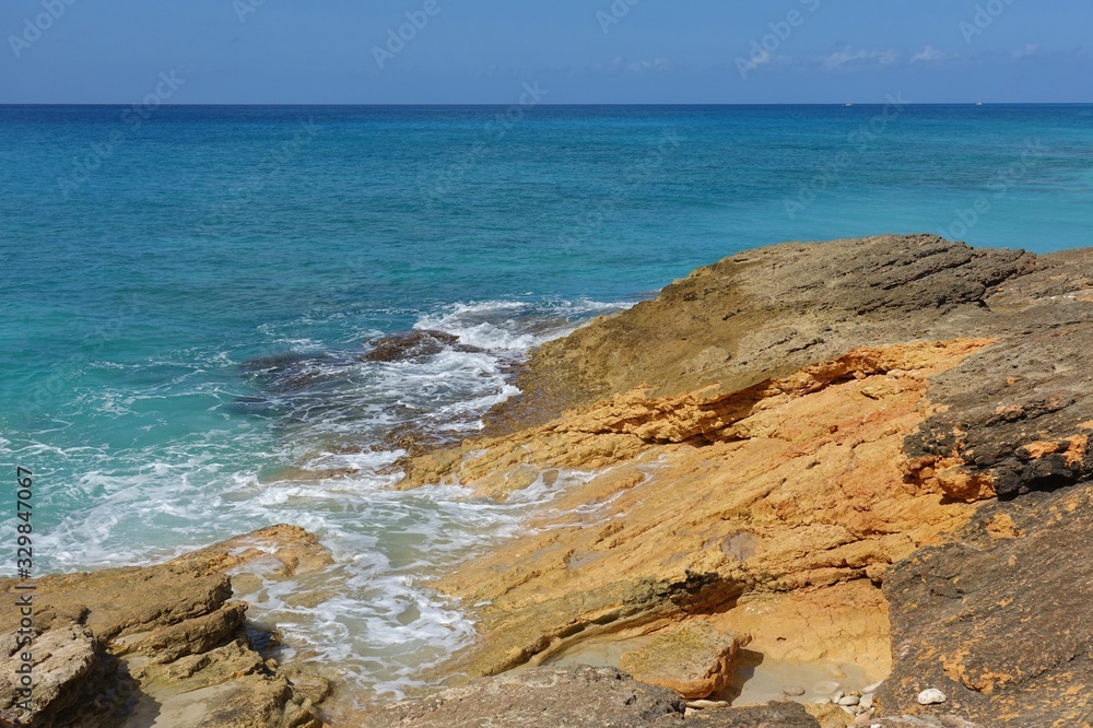 View of a beach on the blue Caribbean Sea in Saint Martin (Sint Maarten), Dutch Antilles View of a beach on the blue Caribbean Sea in Saint Martin (Sint Maarten), Dutch Antilles