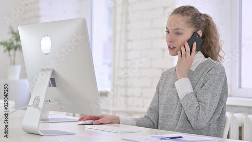 Young Latin Woman Talking on Smartphone