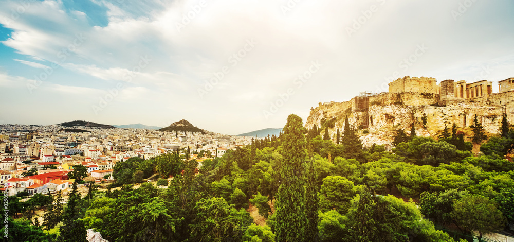 Panoramic view on the cityscape of Athens city from Acropolis with ancient ruins of Parthenon temple on the right, Greece