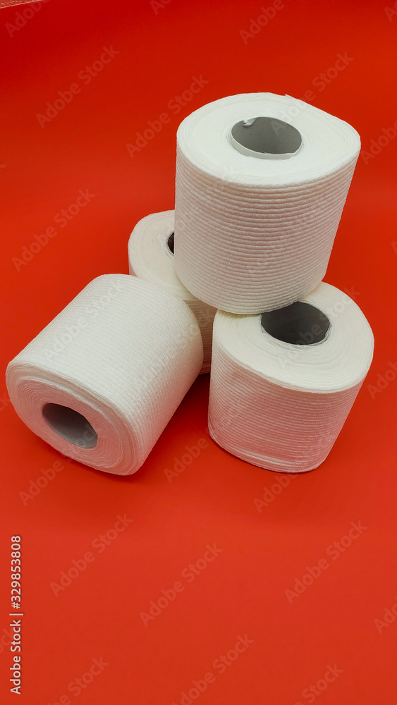 Toilet paper on a red background Toilet paper on a red background