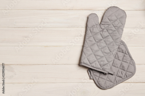 kitchen glove on a white wooden background