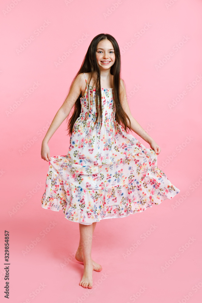 Portrait of adorable smiling little girl child dancing in dress isolated Portrait of adorable smiling little girl child dancing in dress isolated