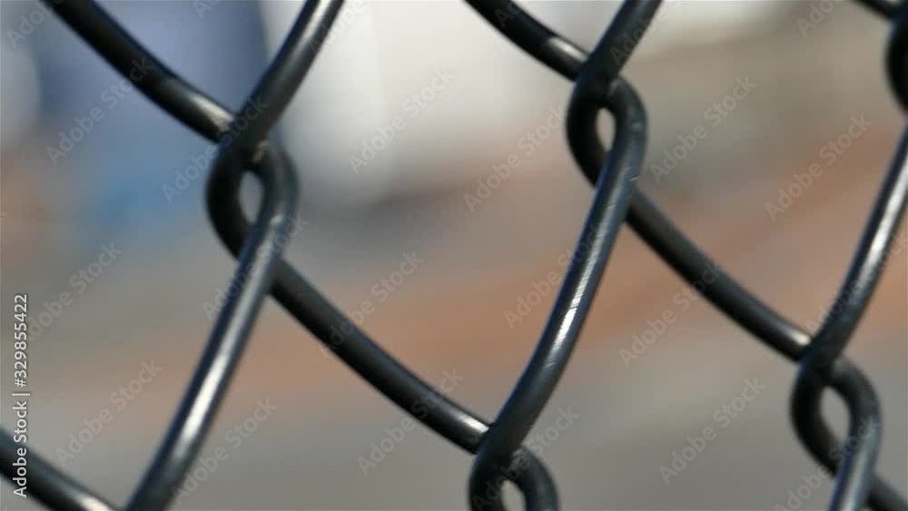 Camera moving from left to right around the wire fence close up Camera moving from left to right around the wire fence close up