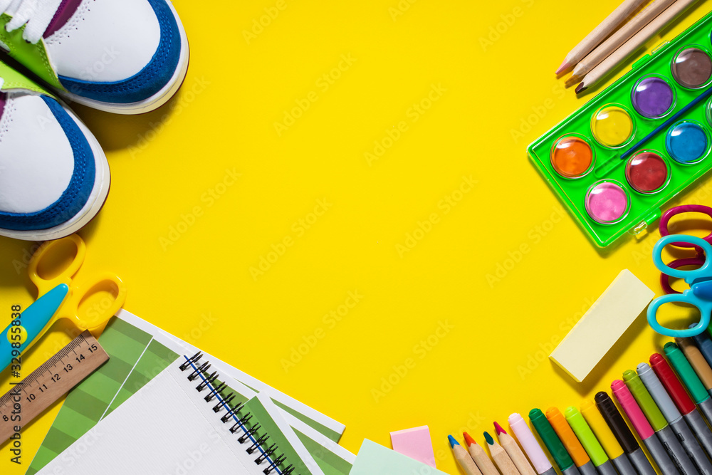 Stationery set on bright yellow background with copy space for your text. Back to school concept. Stationery set on bright yellow background with copy space for your text. Back to school concept.