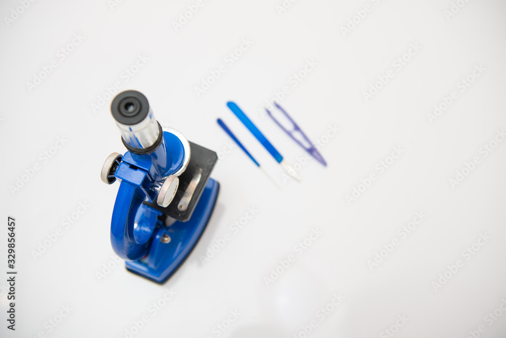 microscope isolated on a white background with research tools microscope isolated on a white background with research tools