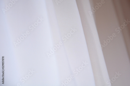  texture of a white curtain.Abstract background template can be used as a wall paper screen saver page 