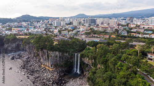 Aerial View of The High Waterfall Jeongbang and Lagoon at Seoqwipo on Jeju Island