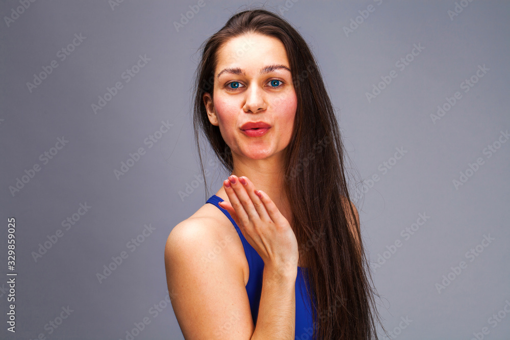 Blow kiss, young caucasian female brunette woman