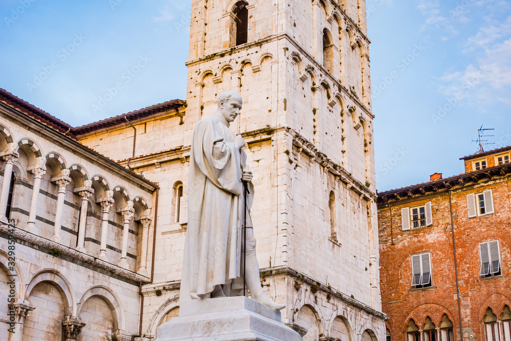 Lucca, Tuscany IT: Square of the cathedral of San Michele in Foro at sunset. Famous for its intact Renaissance-era city walls. Piazza San Michele
