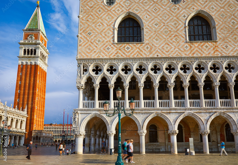 St Mark's Campanile tower famous landmark view on square from arch of Doges Palace Venice Italy.
