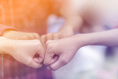 Businessmen fist bump for dealing new project to successful and mission team meeting together congrate.Group of people hands together. Business partnership Concept